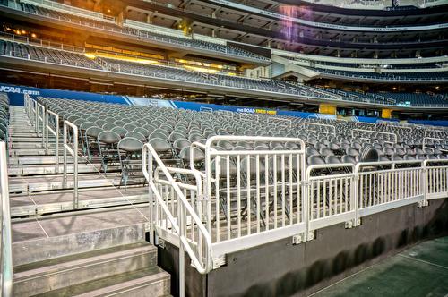 NCAA stadium with sightline platforms and railings setup for the game