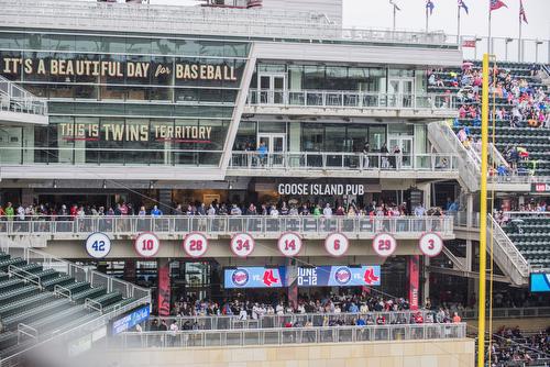 Fans in the stands behind Sightline railings at Target Field