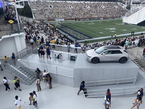 Georgia Tech Hyundai Feild featuring a platform that is supporting an entire car