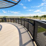 Sightline Commercial_Custom Curved Perforated Metal Railing